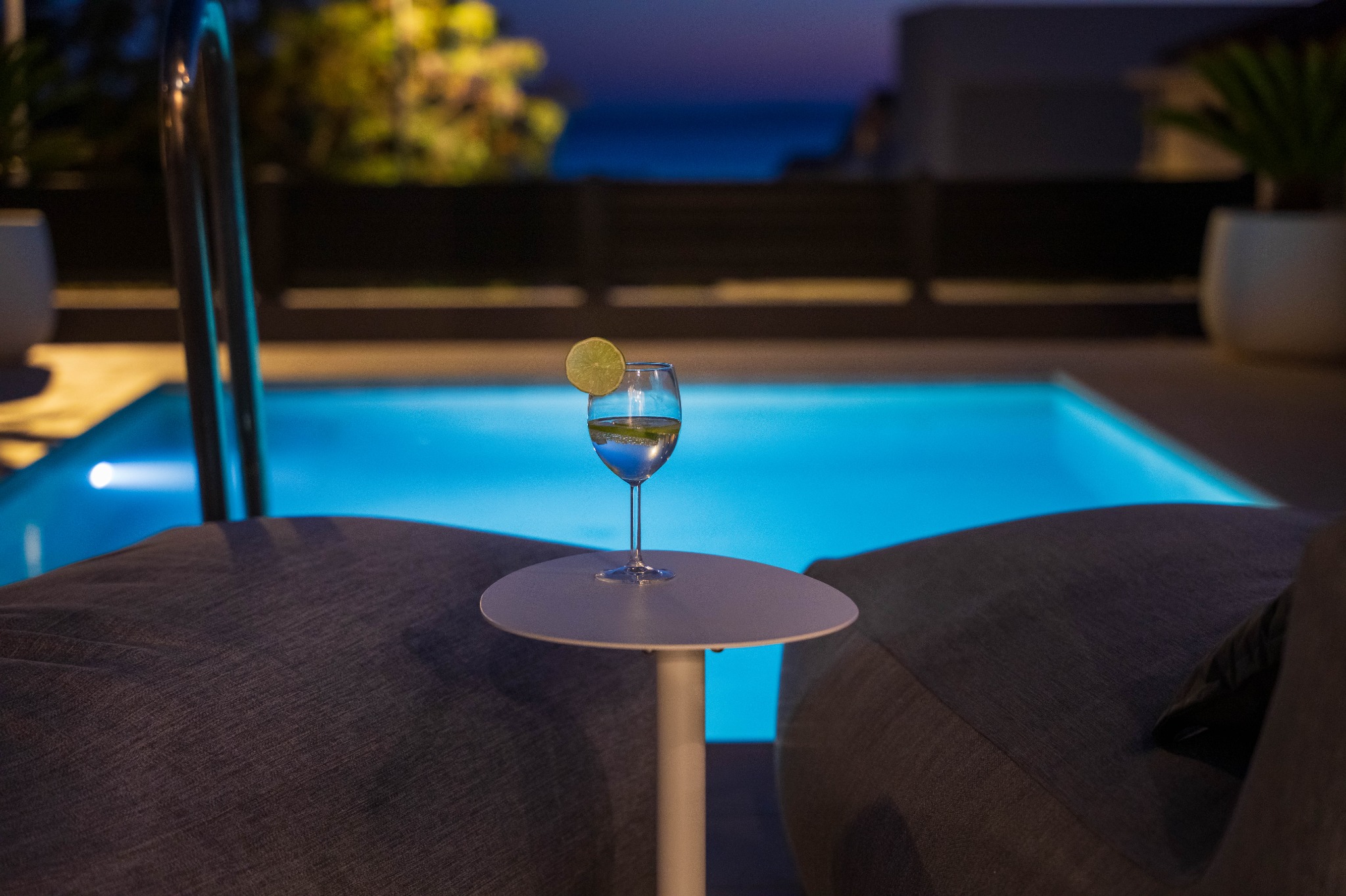Private heated pool at night at Olea Pool Residence with sea view in Novalja, Pag